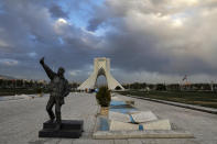 In this Friday, April 3, 2020 photo, a sculpture of a man who makes a selfie photo sits in a mostly empty Azadi (Freedom) Square in Tehran, Iran. The typically frenetic streets of Iran’s capital, Tehran, have fallen silent and empty due to the new coronavirus outbreak that’s gripped the Islamic Republic. (AP Photo/Ebrahim Noroozi)