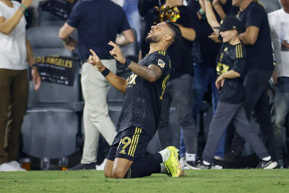 Los Angeles FC forward Denis Bouanga celebrates his goal against the LA Galaxy during the second half of an MLS playoff soccer match Thursday, Oct. 20, 2022, in Los Angeles. Los Angeles FC won 3-2. (AP Photo/Ringo H.W. Chiu)