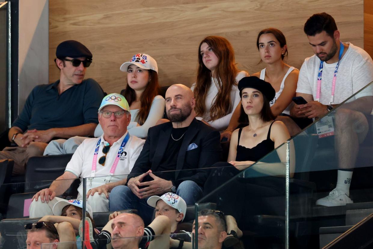 paris, france august 03 david zaslav, ceo of warner bros discovery, actor, john travolta and actress, ella bleu travlota attend the artistic gymnastics mens floor exercise final on day eight of the olympic games paris 2024 at bercy arena on august 03, 2024 in paris, france photo by pascal le segretaingetty images