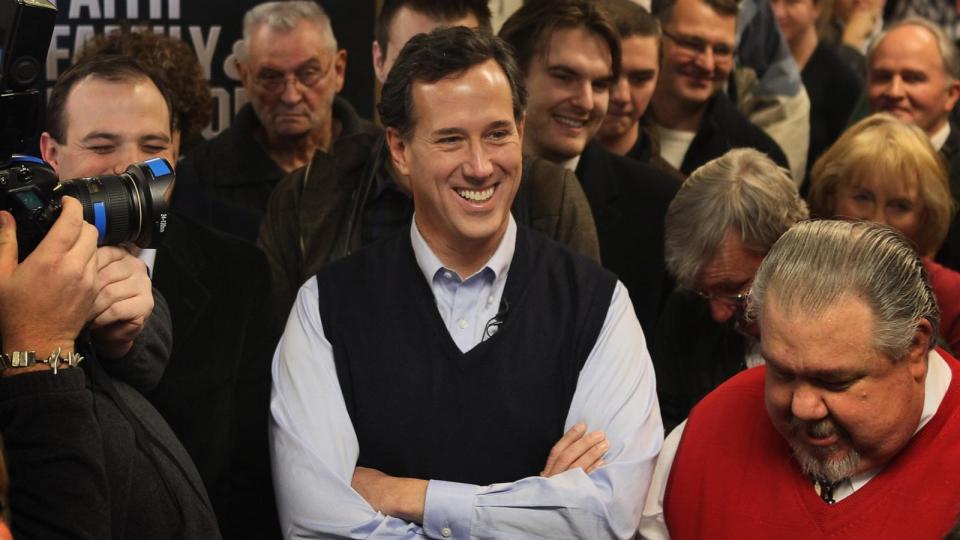 PHOTO: Republican presidential candidate former Senator Rick Santorum waits to be introduced during a campaign stop at the Daily Grind coffee shop,  Jan. 1, 2012, in Sioux City, Iowa.  (Scott Olson/Getty Images)