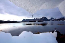 An iceberg melts in Kulusuk, Greenland, near the Arctic Circle. Scientists say that global warming has an increasing effect on the Arctic region, with glaciers shrinking, temperatures of the arctic waters rising and permafrost thawing.