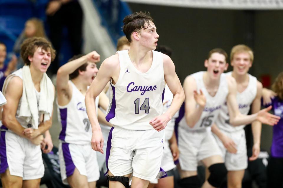 Canyon’s Kemper Jones (14) runs down the court after making a shot during the UIL 4A Regional Semifinal game between Argyle and Canyon on Friday, March 4, 2022, at the Rip Griffin Center in Lubbock, Texas.