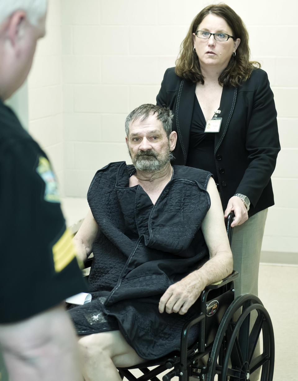 Frazier Glenn Cross, also known as Frazier Glenn Miller, appears at his arraignment in New Century, Kan., Tuesday, April 15, 2014. Cross is being charged for shootings that left three people dead at two Jewish community sites in suburban Kansas City on April 13. At upper right is Michelle Durrett, attorney with the public defender's office. (AP Photo/The Kansas City Star, David Eulitt, Pool)