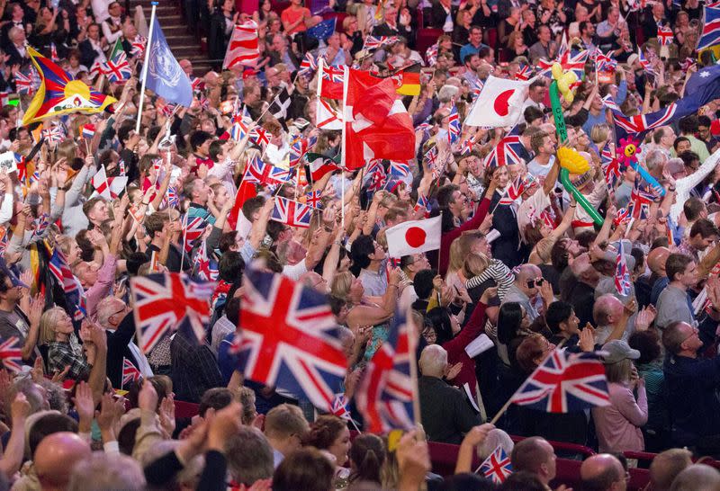 FILE PHOTO: Revellers wave flags during the last night of the BBC Proms festival of classical music at the Royal Albert Hall in London, Britain