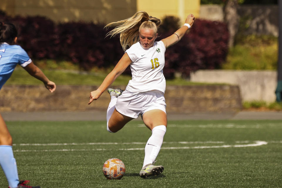 In this photo provided by Cal Poly Humboldt, Megan Janikowski plays the ball during a soccer match at College Creek Field in Arcata, Calif., on Sept. 23, 2023. Janikowski of Cal Poly Humboldt and Reedley College football player Jamel Pink have been honored with the CalHOPE Courage Award for November for overcoming adversity to succeed on the field and in the classroom. (Max Tepper/Cal Poly Humboldt via AP)