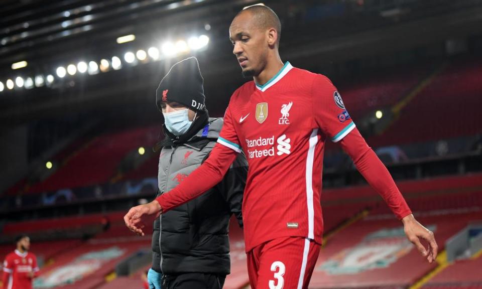 Fabinho leaves the game after picking up an injury during Liverpool’s win against Midtjylland at Anfield.