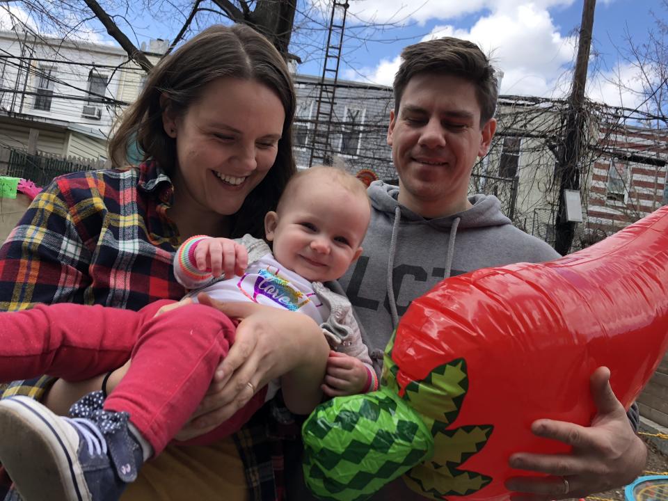 Abortion rights advocate Erika Christensen and her husband, Garin Marschall, hold their 1-year-old daughter Pepper.