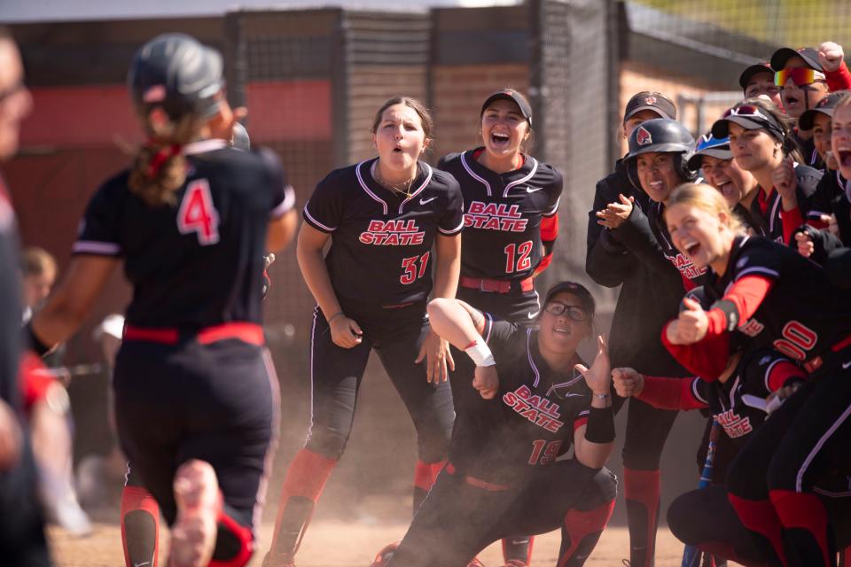 Ball State softball celebrates at home plate in the team's game against Miami (Ohio) at First Merchants Ballpark on Wednesday, April 26, 2023.