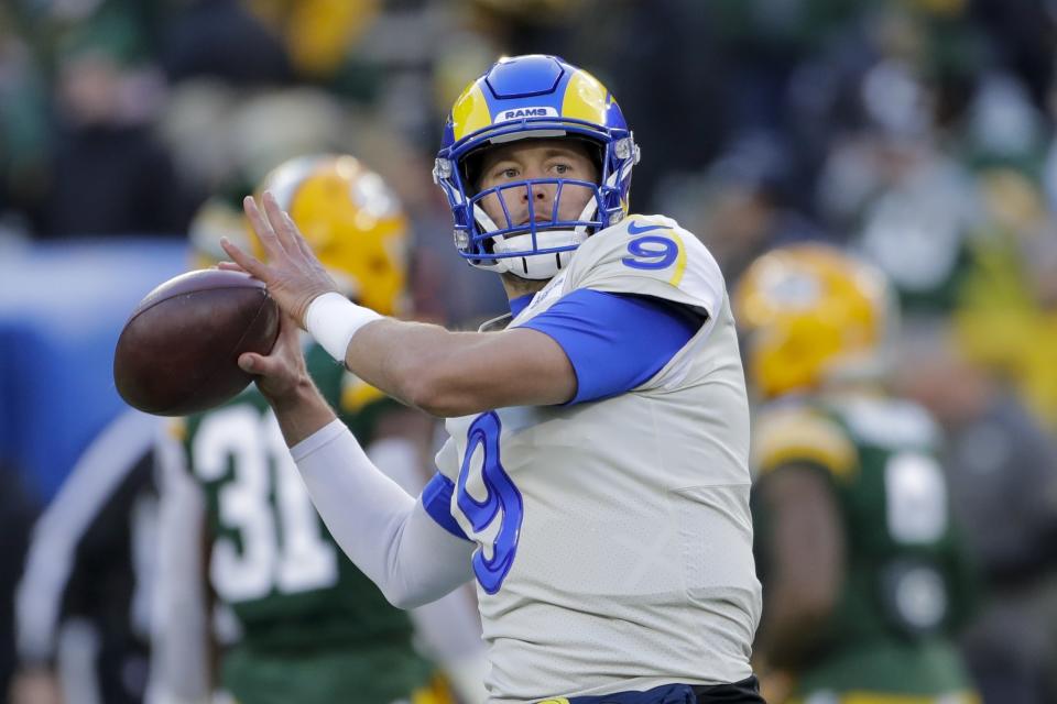 Los Angeles Rams' Matthew Stafford warms up before an NFL football game against the Green Bay Packers Sunday, Nov. 28, 2021, in Green Bay, Wis. (AP Photo/Aaron Gash)