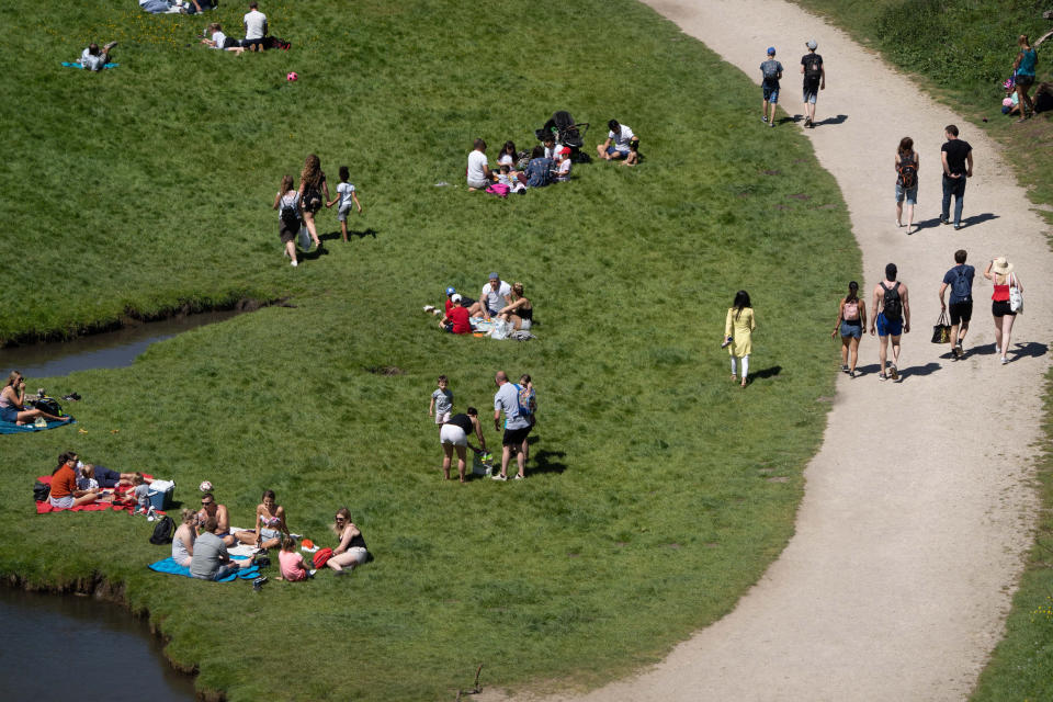 Some sunbathers did their best to adhere to social distancing, while others seemed to take a more relaxed approach to the government's guidance.