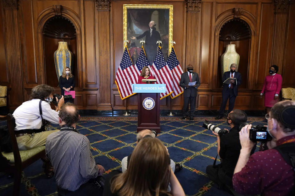 House Speaker Nancy Pelosi of Calif., center, with House Democrats, speaks during a news conference about COVID-19, Thursday, Sept. 17, 2020, on Capitol Hill in Washington. From left are Rep. Debbie Mucarsel-Powell, D-Fla., Pelosi, Rep. James Clyburn, D-S.C., Chairman of the House Energy and Commerce Committee Rep. Frank Pallone, D-N.J., and Rep. Lauren Underwood, D-Ill. (AP Photo/Jacquelyn Martin)