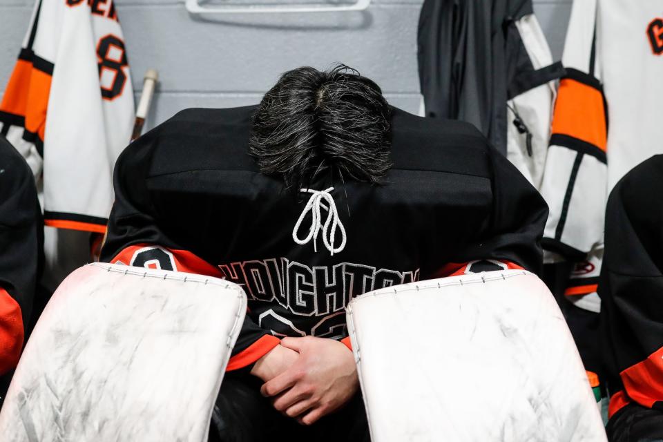 Houghton goaltender Bryant Lee takes a moment in the locker room before the MIHL Prep Hockey Showcase against Novi Detroit Catholic Central at Kennedy Ice Arena in Trenton on Friday, Feb. 2, 2024.