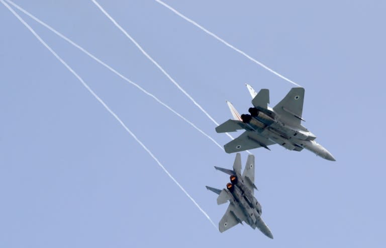 Israeli F-15 fighter jets rehearse over Tel Aviv on April 12, 2018, ahead of an air show to commemorate the 70th anniversary of the creation of Israel