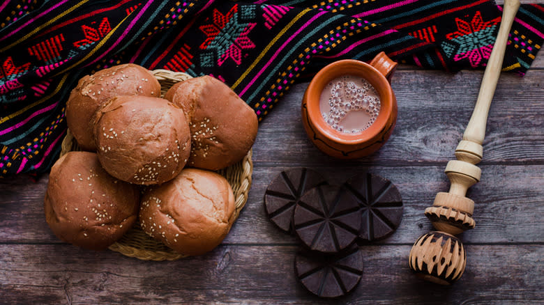 molinillo with hot chocolate and basket of bread