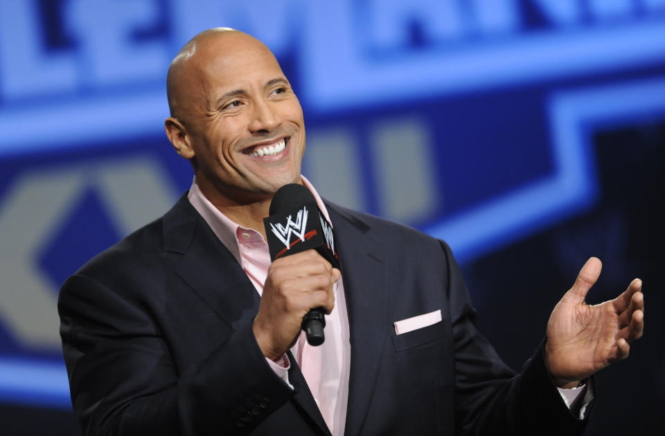 FILE - Actor and former WWE Superstar Dwayne "The Rock" Johnson participates in a news conference on Wednesday, Mar. 30, 2011 in New York. As WWE gears up for its biggest annual premium live event in April 2024, the company continues to harness the power of its social media presence to reach its fans. A key component of that strategy is YouTube, where WWE has hit an important milestone: reaching 100 million subscribers. (AP Photo/Evan Agostini, file)