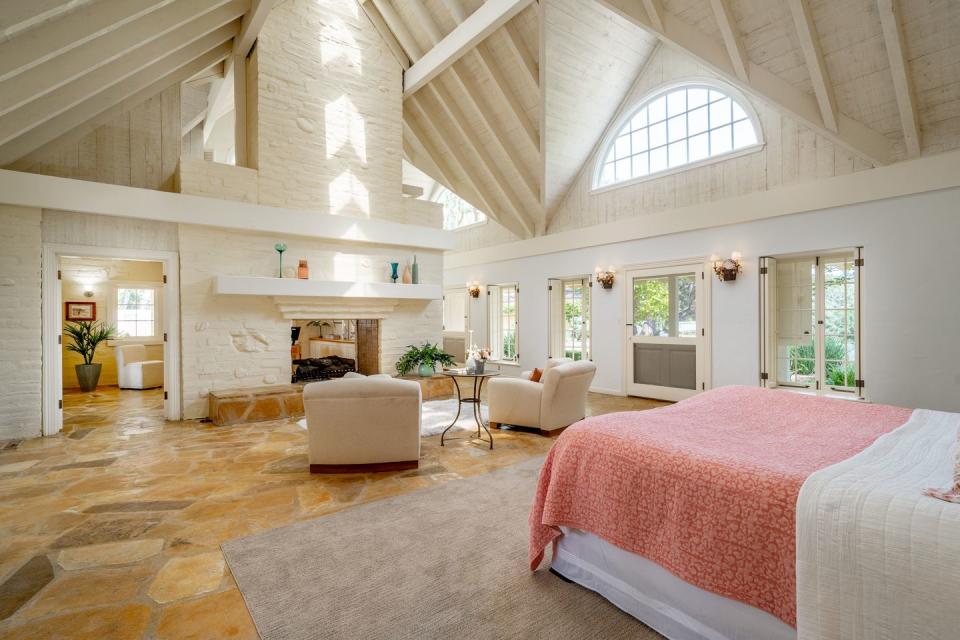 Day's large bedroom includes its own sitting area and fireplace.