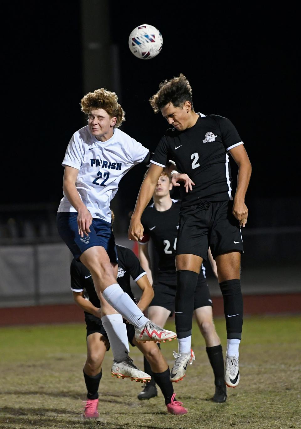 Parish's Ryder Spisak (#22) goes almost head to head with Braden River's Brunno Reus (#2) during the game. The Parish Bulls won the Class 5A-District 10 final Thursday night 1-0 over the hosting Braden River Pirates.