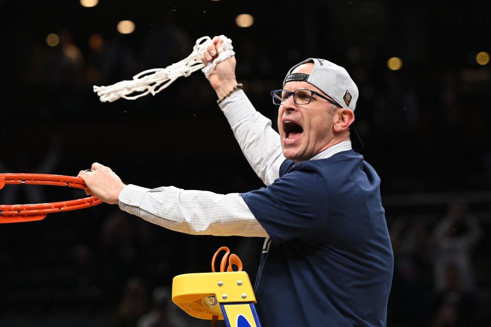 Connecticut head coach Dan Hurley, the former URI coach, cuts the net after defeating Illinois in the finals of the East Regional last week.