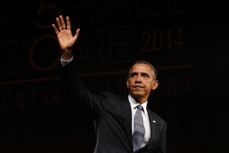 U.S. President Barack Obama waves after speaking at a Civil Rights Summit to commemorate the 50th anniversary of the signing of the Civil Rights Act at the LBJ Presidential Library in Austin, Texas, April 10, 2014. REUTERS/Kevin Lamarque