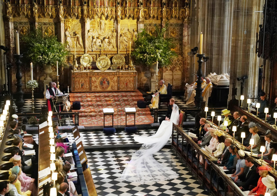 Prince Harry and Meghan Markle listen to an address by the Most Rev Bishop Michael Curry, primate of the Episcopal Church, in St George's Chapel at Windsor Castle during their wedding service.