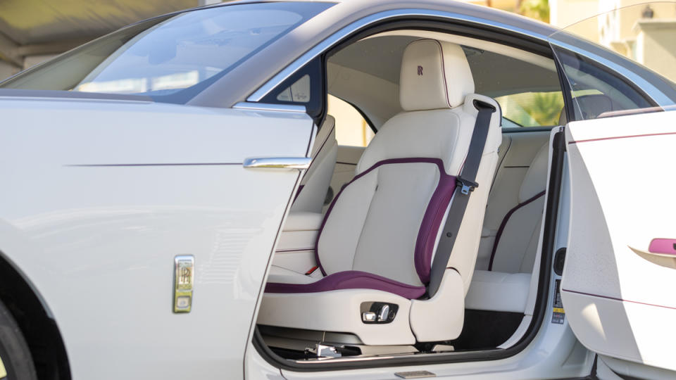 A peek at the interior of a Rolls-Royce Spectre in Arctic White with contrasting Tempest Grey.