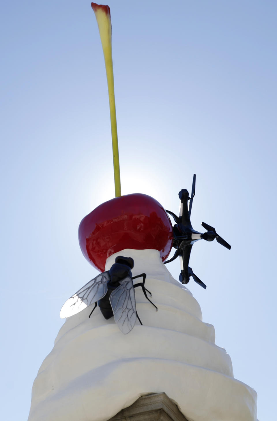 A new work of art entitled 'The End' by artist Heather Phillipson is seen after it was unveiled on the fourth plinth in Trafalgar Square in London, Thursday, July 30, 2020. Described as representing "exuberance and unease" and a "monument to hubris and impending collapse", The End, by British artist Heather Phillipson, will stay in place until spring 2022. (AP Photo/Alastair Grant)