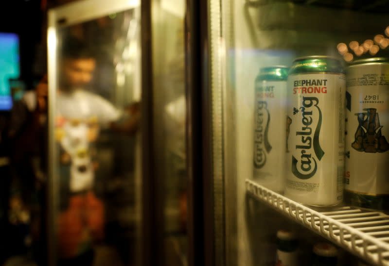 FILE PHOTO: Carlsberg beer cans are seen at a pub in Mumbai