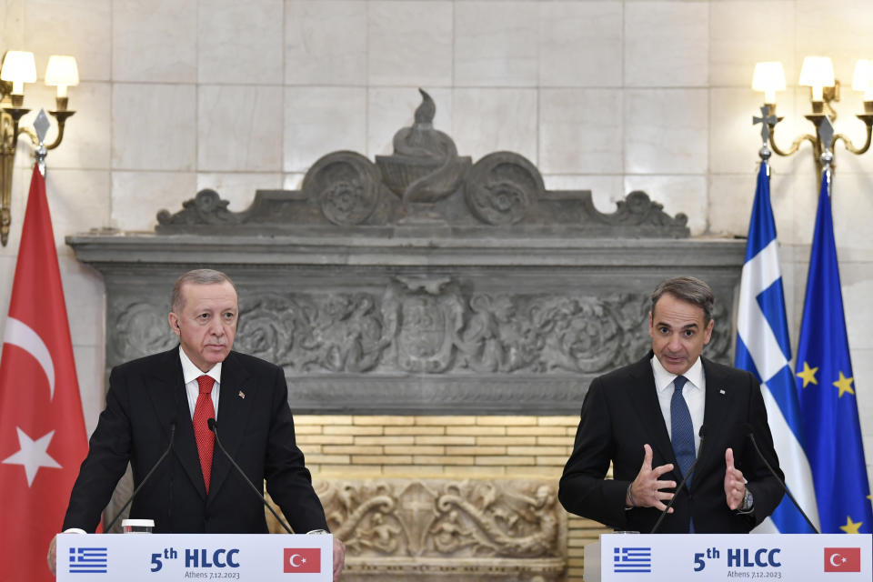 Greece's Prime Minister Kyriakos Mitsotakis, right, makes statements with Turkey's President Recep Tayyip Erdogan after their meeting at Maximos Mansion in Athens, Greece, Thursday, Dec. 7, 2023. Turkish President Recep Tayyip Erdogan is visiting Greece in an effort to mend strained relations and reset ties with Western allies. (AP Photo/Michael Varaklas)