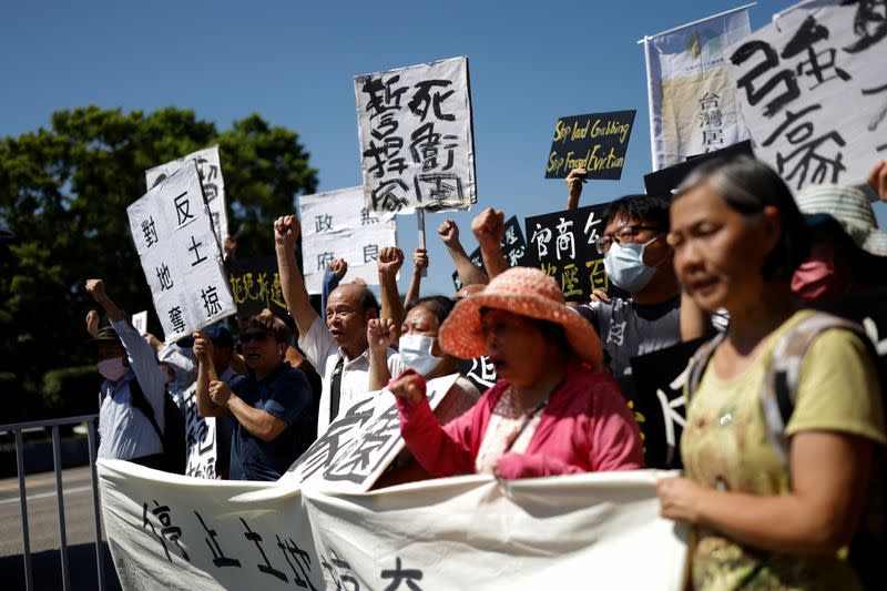 Longtan residents take part in a protest against the expansion of an industrial park for advanced chip manufacturing in Taoyuan, near the presidential office in Taipei