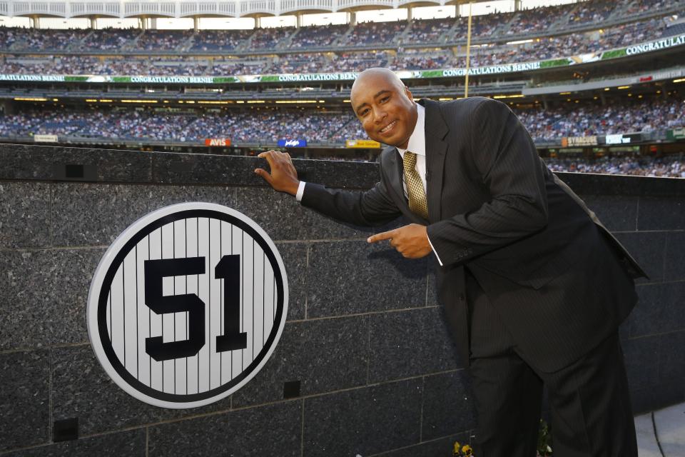 New York Yankees&#39; Bernie Williams poses by his retired number in Monument Park before a baseball game against the Texas Rangers Sunday, May 24, 2015, at Yankee Stadium in New York. (AP Photo/Al Bello, Pool)