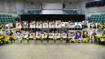 Photos of people involved in a fatal bus crash are seen before a vigil at the Elgar Petersen Arena, home of the Humboldt Broncos, in Humboldt, Saskatchewan, April 8, 2018. Jonathan Hayward/Pool via REUTERS