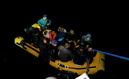 A group of Tunisian migrants arrive on a rubber boat after being rescued by the Tunisian coast guard off the coast of Bizerte, Tunisia October 12, 2017. Picture taken October 12, 2017. REUTERS/Zoubeir Souissi