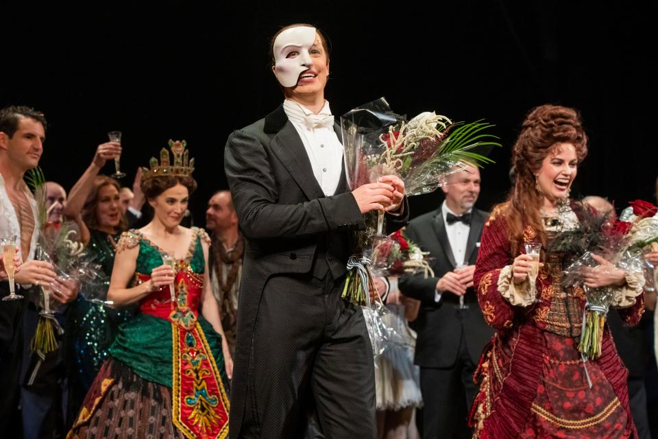 Laird Mackintosh, center, and cast members take a bow after the last Broadway performance of "Phantom."