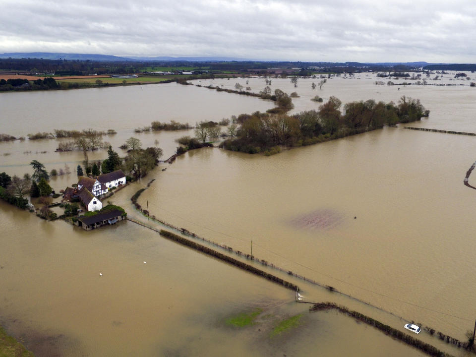 A house in Pixham, Worcestershire is surrounded in flood water after the River Severn burst its banks. (Photo by Steve Parsons/PA Images via Getty Images)