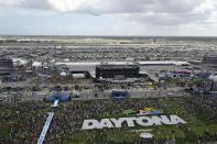 Air Force One, carrying President Donald Trump, makes a pass over Daytona International Speedway before the NASCAR Daytona 500 auto race Sunday, Feb. 16, 2020, in Daytona Beach, Fla. (AP Photo/Phelan M. Ebenhack)