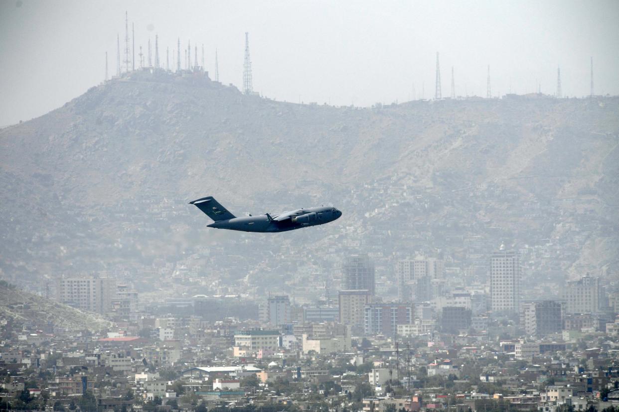 US Air Force aircraft takes off from the airport in Kabul on 30 August (AFP via Getty Images)