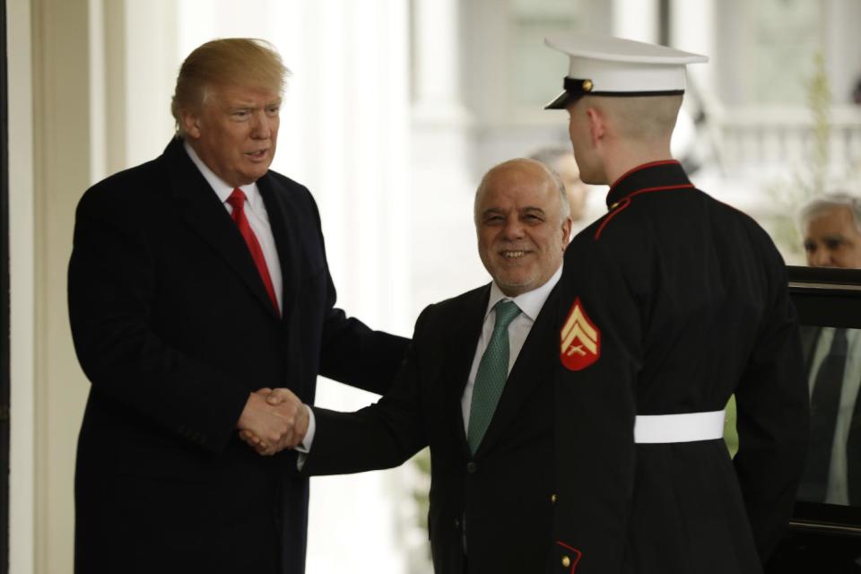 President Donald Trump greets Iraqi Prime Minister Haider al-Abadi upon his arrival to the White House in Washington, Monday, March 20, 2017. (AP Photo/Evan Vucci)