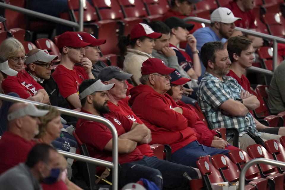 Fans watch a baseball game between the St. Louis Cardinals and the Pittsburgh Pirates Tuesday, May 18, 2021, in St. Louis. The Cardinals have significantly loosened their COVID-19 guidelines, saying fully vaccinated fans attending games at Busch Stadium will no longer be required to wear masks inside the ballpark. (AP Photo/Jeff Roberson)