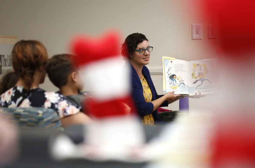 Colleen Garcia reads Dr. Seuss's new book Horse Museum to children at UC San Diego's Geisel Library on Tuesday, Sept. 3, 2019. The school celebrated the release of a previously unpublished book by Dr. Seuss, the pseudonym for the late La Jolla author Theodor Geisel. The new book is titled Dr. Seuss's Horse Museum and "is based on a manuscript and sketches by Dr. Seuss that was discovered in 2013," according to UC San Diego. "It includes cameos by classic Dr. Seuss characters, such as the Cat in the Hat and the Grinch, while featuring whimsical illustrations inspired by Dr. Seuss's original sketches."