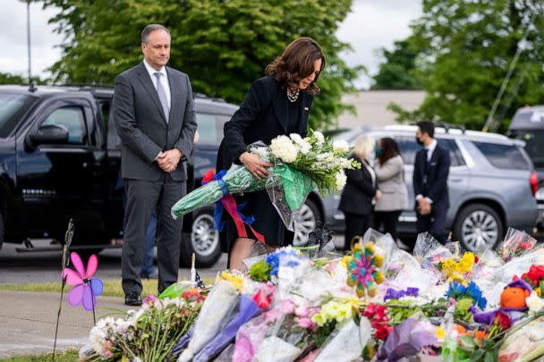 PHOTO: Vice President Kamala Harris and Second Gentleman Doug Emhoff pay their respects on May 28, 2022, at a memorial at Tops Friendly Market, the site of a mass shooting in Buffalo, New York. (Kent Nishimura/Los Angeles Times via Getty Images)
