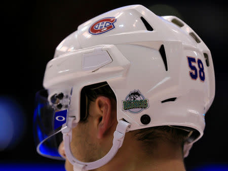 Apr 7, 2018; Toronto, Ontario, CAN; Montreal Canadiens defenseman Noah Juulsen (58) displays the logo of the Humboldt Broncos on his helmet during a game against the Toronto Maple Leafs at the Air Canada Centre. Mandatory Credit: John E. Sokolowski-USA TODAY Sports