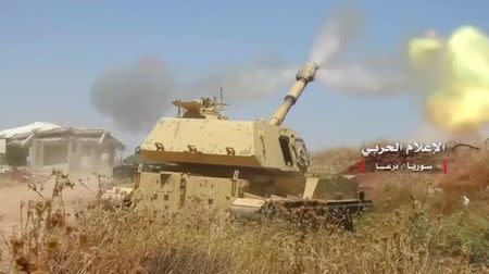 A Syrian heavy artillery unit shoots in Deraa province, Syria, in this still image from a video obtained on July 5, 2018. CENTRAL MILITARY MEDIA/via REUTERS