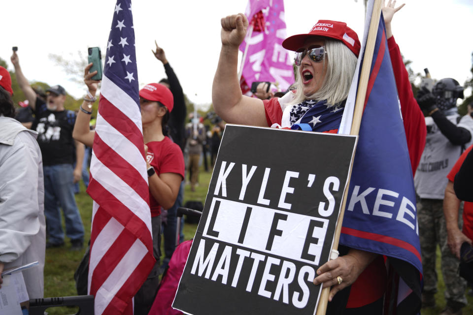 Members of the Proud Boys and other right-wing demonstrators rally on Saturday, Sept. 26, 2020, in Portland, Ore. Last month, Aaron “Jay” Danielson, a Trump supporter and Patriot Prayer follower, was shot and killed after some vehicles in a pro-Trump car caravan diverted into downtown Portland and crossed paths with left-wing activists. The Proud Boys mentioned Danielson in their permit application for the rally Saturday, as well as Kyle Rittenhouse, the 17-year-old charged in the shooting deaths of two Black Lives Matter protesters in Kenosha, Wis. (AP Photo/Allison Dinner)