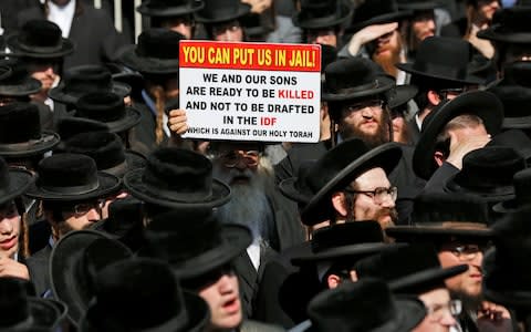 Ultra-Orthodox Jews protest against army recruitment - Credit: EPA