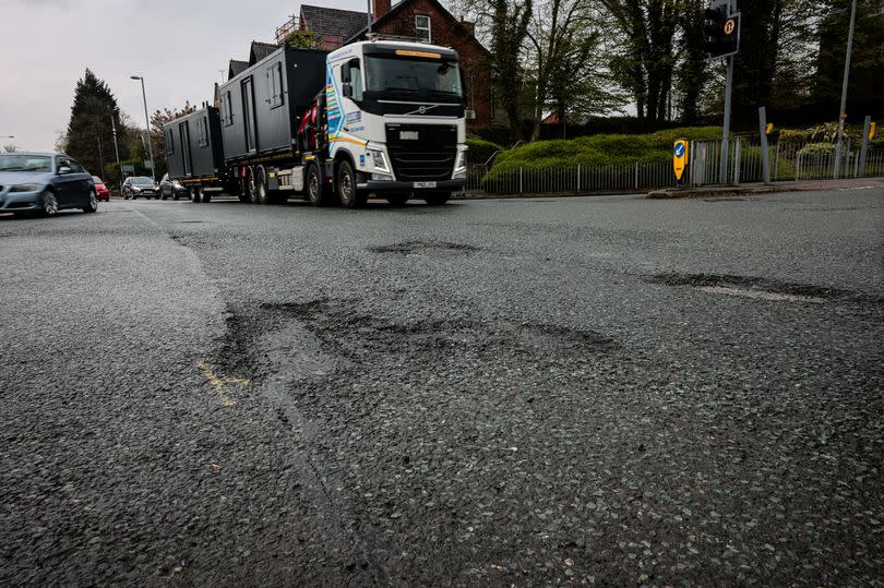 The woeful state of the road at the junction of Bury New Road, Stanley Road, and Church Lane.