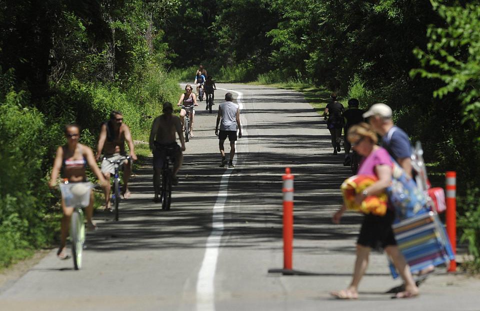 Bicycling is a popular activity on the Multi-Purpose Trail at Presque Isle State Park. An increasing number of riders are using e-bikes.