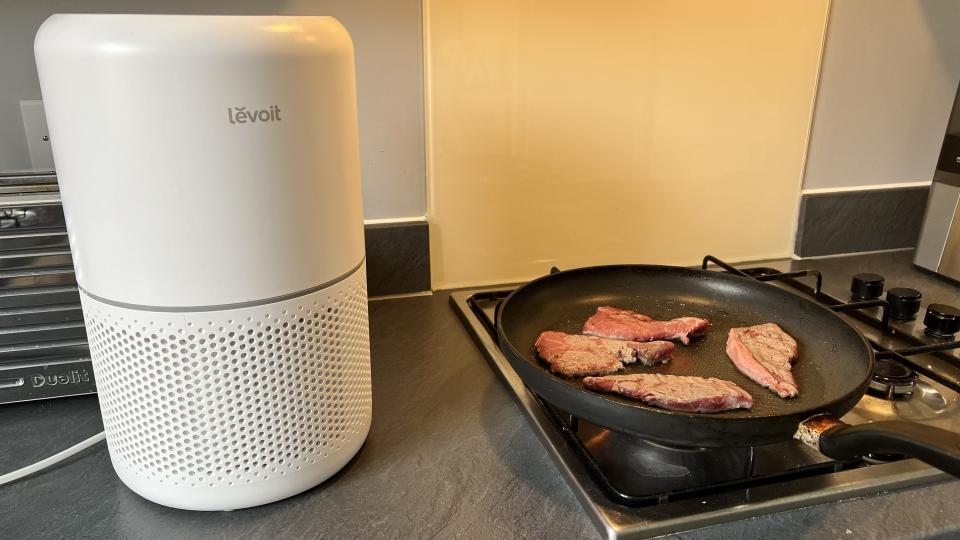 Levoit next to steak cooking