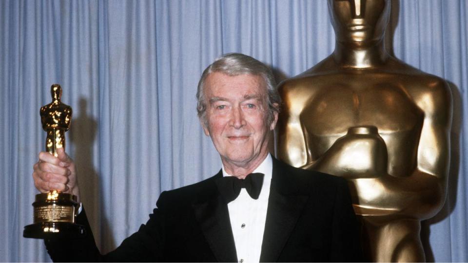 James Stewart holding an Academy Award 