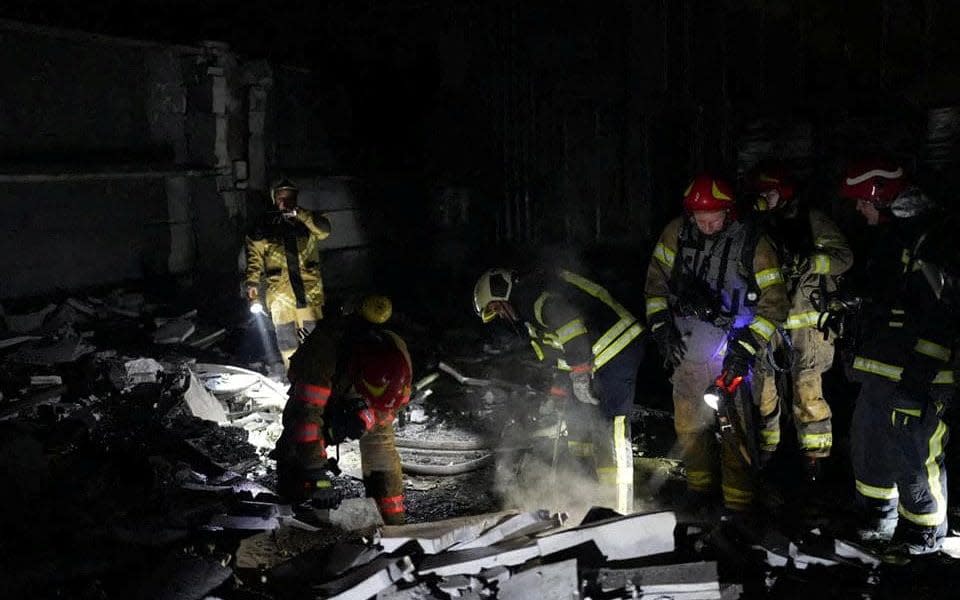 Rescuers work at the site where a building was damaged in the night by Russian drone strikes in Kyiv - STATE EMERGENCY SERVICE OF UKRAINE/via REUTERS