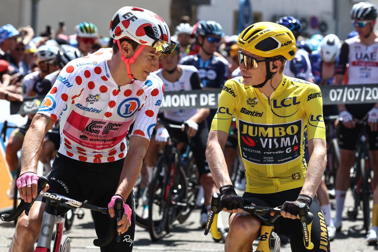 Neilson Powless and Jonas Vingegaard share words before the start of the stage (AFP via Getty Images)